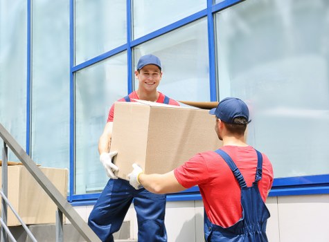 Moving team handling furniture during a van service