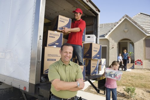 Professional movers working in a Belgravia residential property