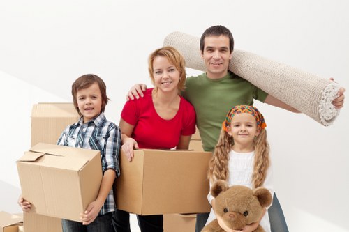 Careful loading of household items into a van for a Belgravia move