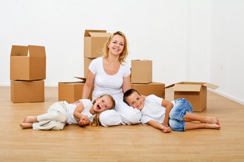 Careful manual handling of a heavy item during a move