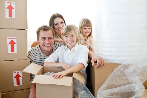 Professional removal crew handling furniture and boxes in Belgravia
