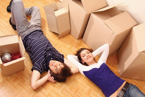 Removal team handling furniture in a Belgravia townhouse setting