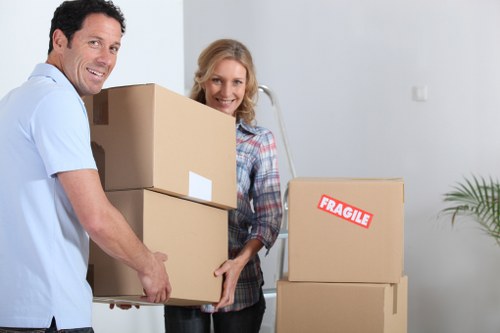 Careful wrapping of fragile household items during packing